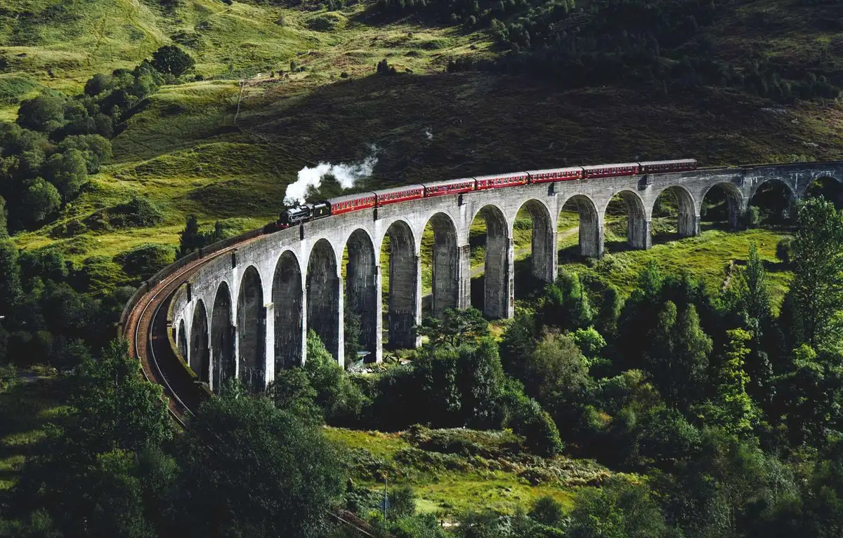 Aerial view of the 21-arch Glenfinnan Viaduct curving above Loch Shiel on a 2-day Highlands tour with Hogwarts Express in the Scottish Highlands